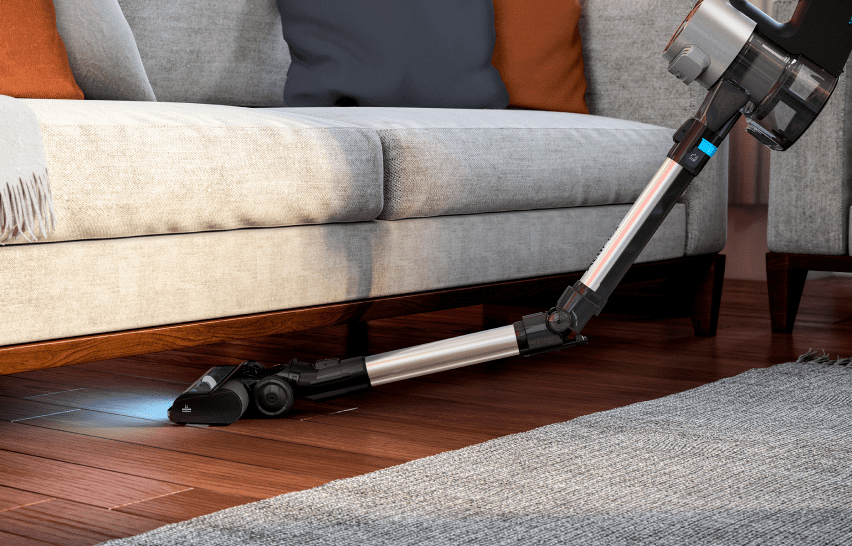 Вертикальный пылесос Grundig VCP 8931 с гибким корпусом под диваном